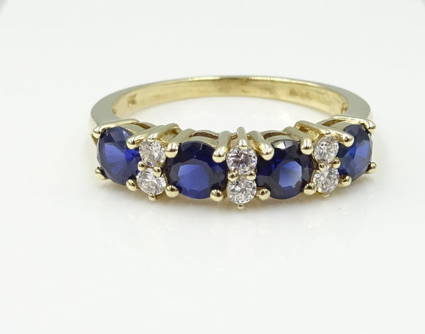 9ct gold CZ and synthetic Sapphire 1/2 eternity ring. 2.4gr