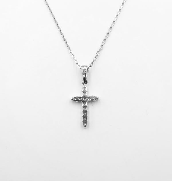 18ct white gold diamond set cross on chain. 0.20ct total. 2.75gr
